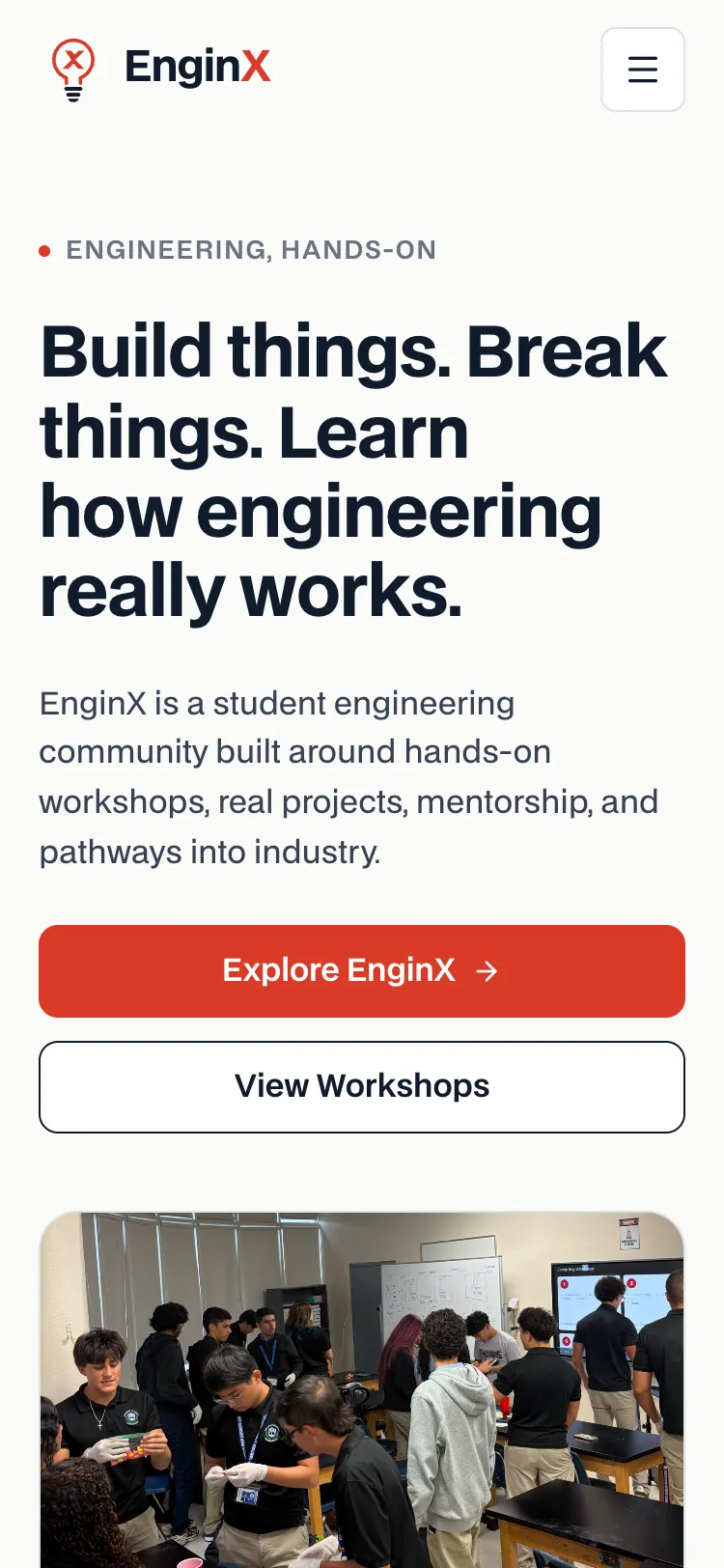 The EnginX homepage on a phone-sized screen: the logo and a menu button, the headline, full-width Explore EnginX and View Workshops buttons, and the workshop photo below